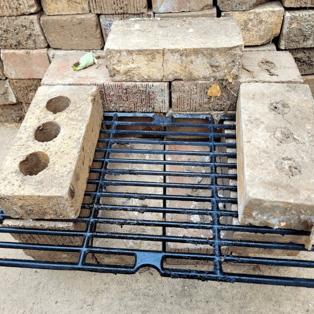 Image illustrates an off-grid rocket stove building tutorial. 