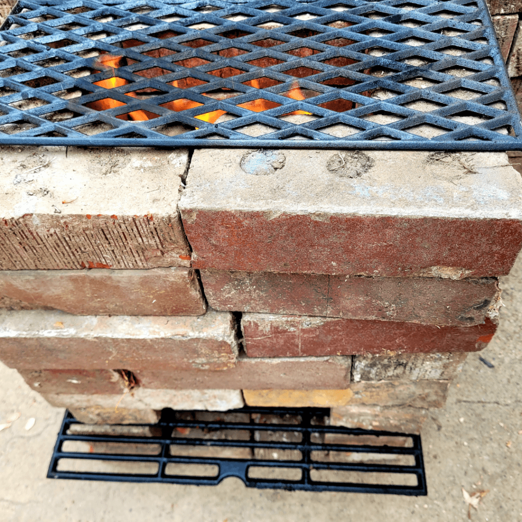Image illustrates an off-grid rocket stove building tutorial. 