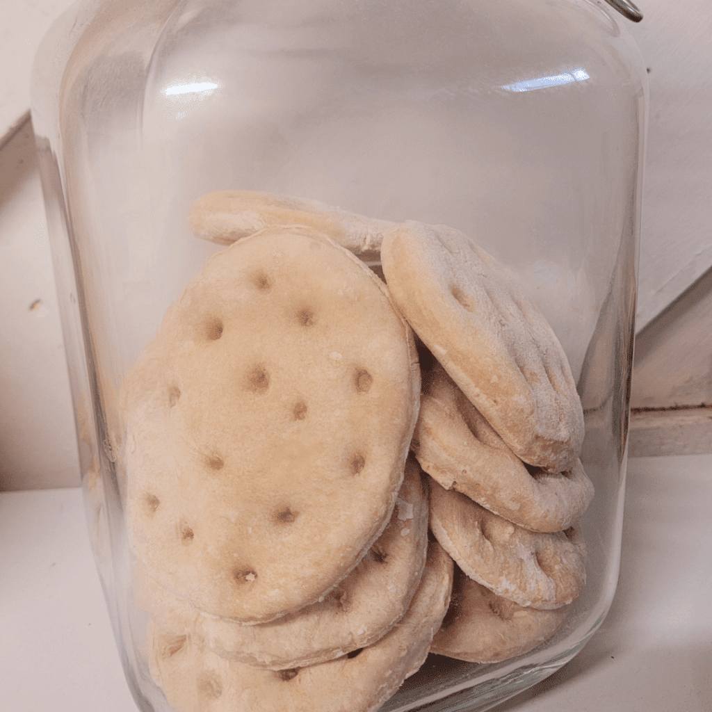 Image illustrates hardtack survival biscuits.