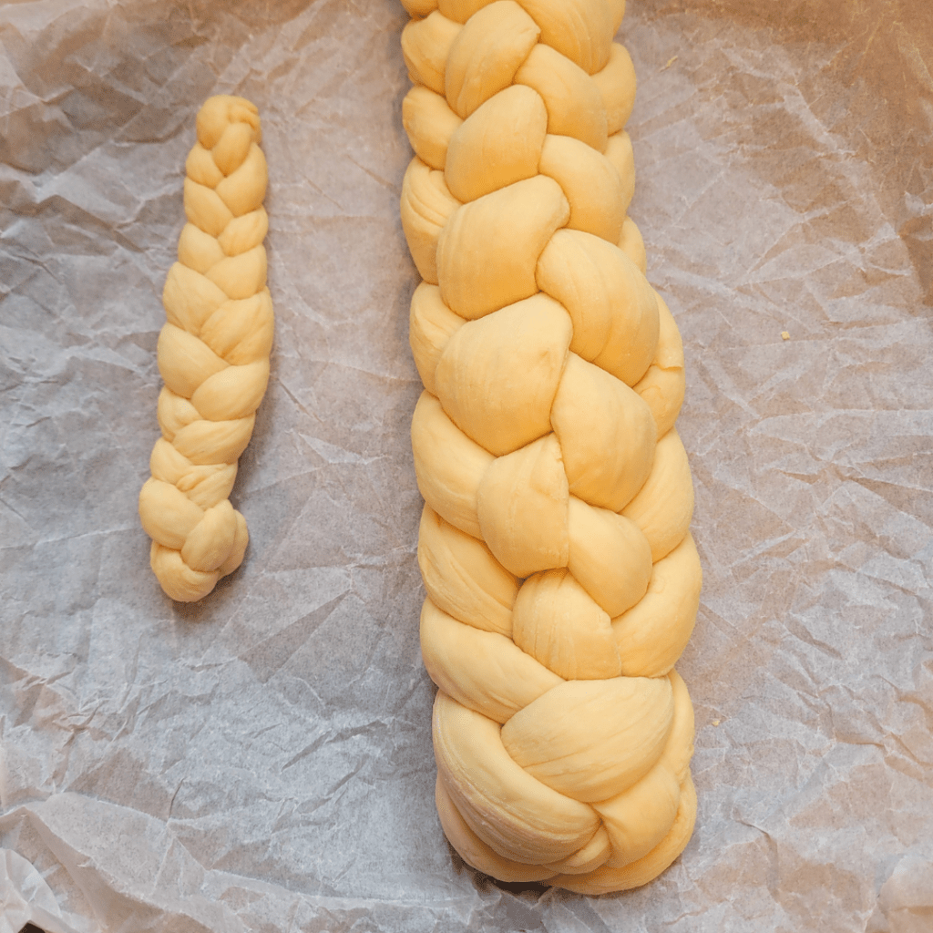 Image illustrates a 6 braided challah bread demonstrating how to braid a challah bread.