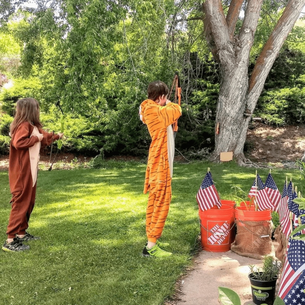 Image illustrates a kid with a bow and arrow for archery for kids.