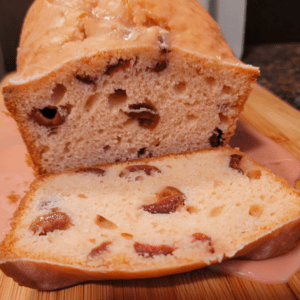 Image illustrates cherry bread with cherry glaze