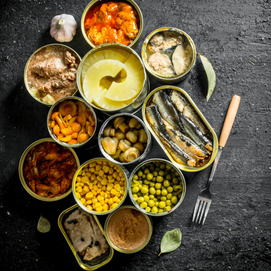 Image illustrating a feast of open cans demonstrating how to open a can of food with your bare hands. 