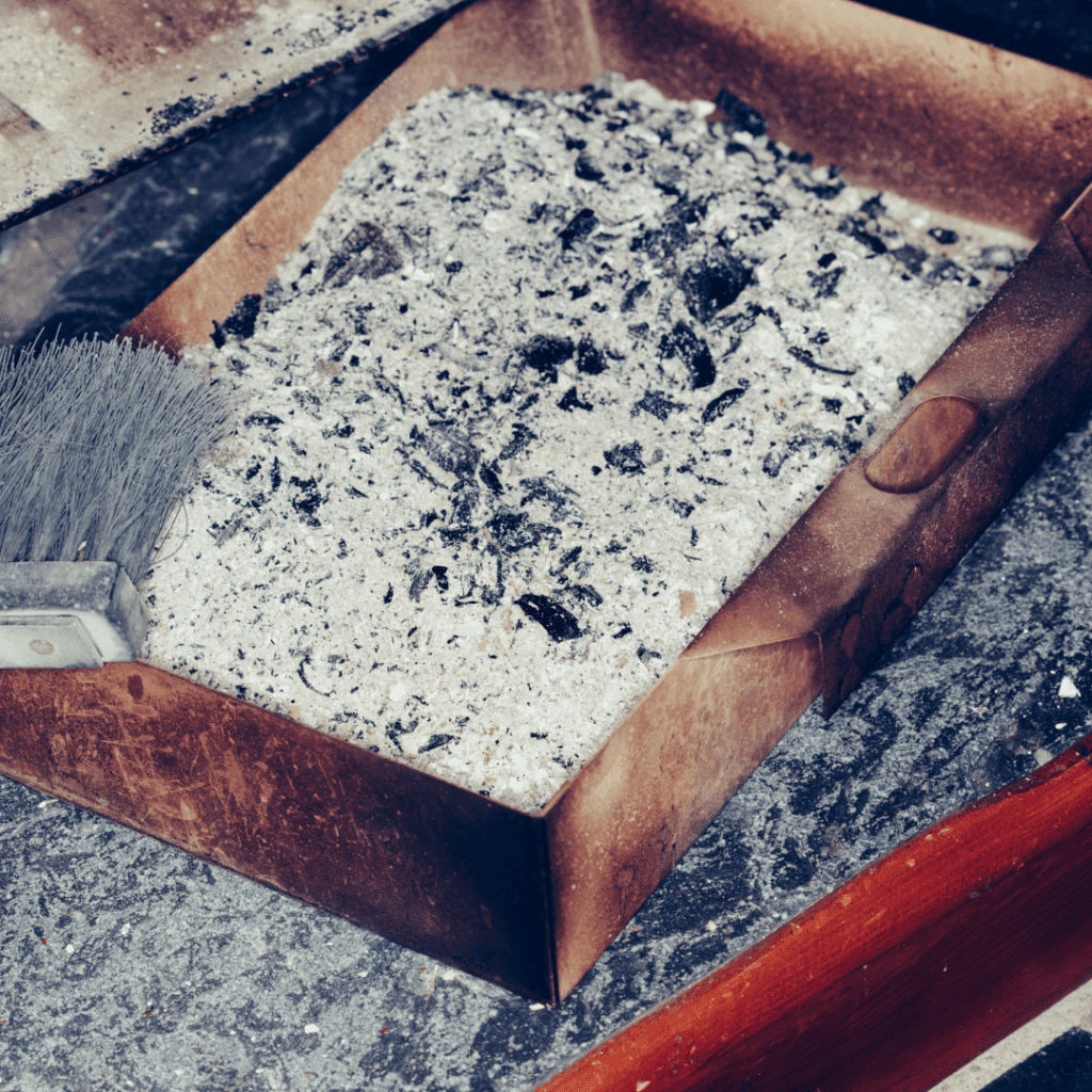 Image illustrates cleaning a wood-burning stove. 