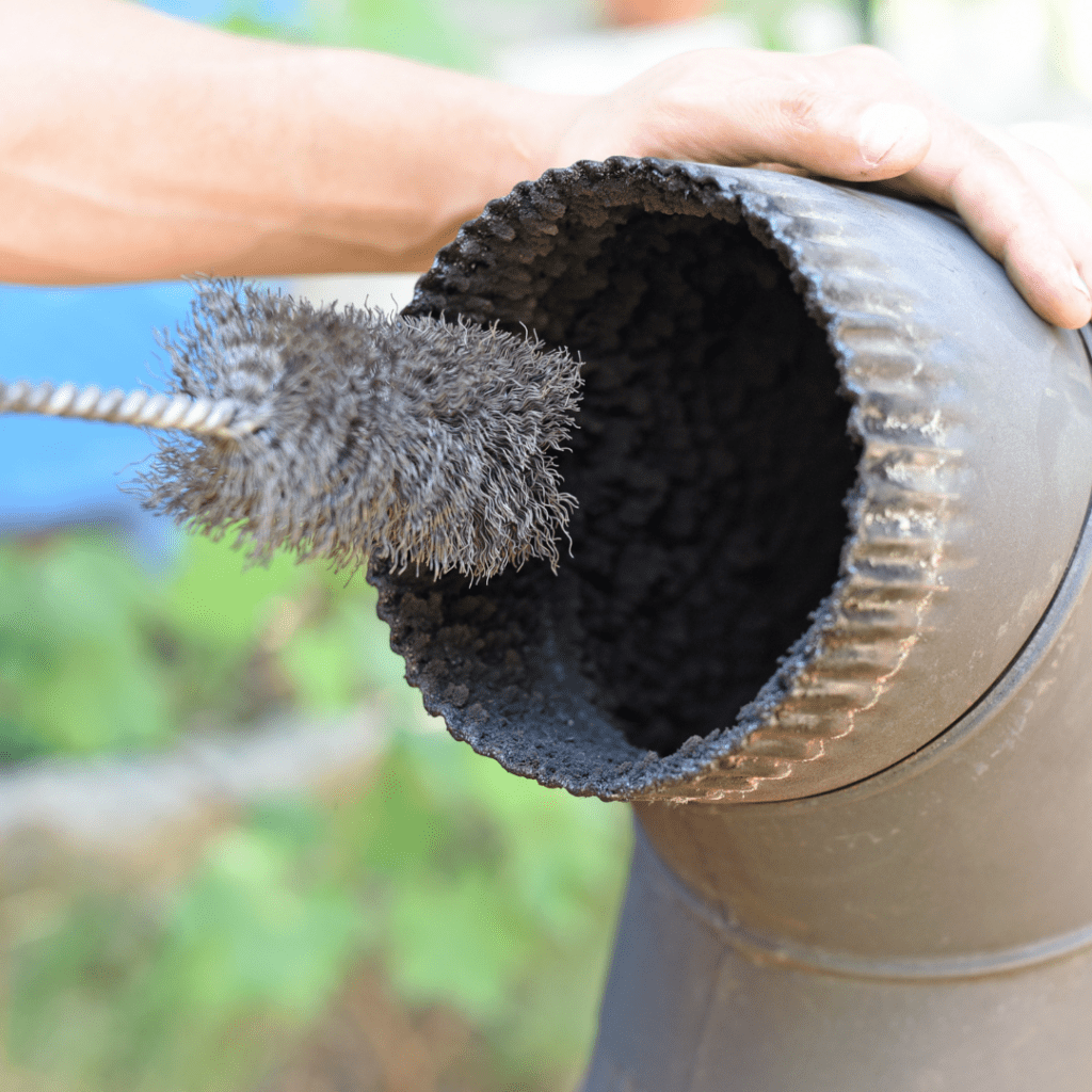Image illustrates cleaning a wood-burning stove. 