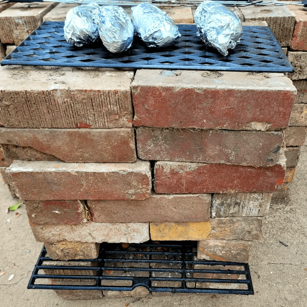 Image illustrates an off-grid rocket stove. 