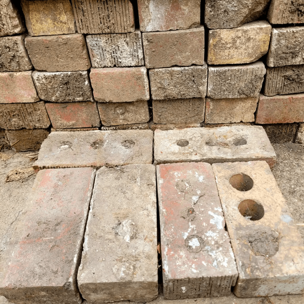 Image illustrates an off-grid rocket stove building tutorial. 