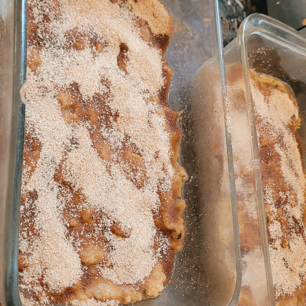 Image illustrates raw snickerdoodle zucchini bread with cinnamon and sugar topping ready for baking. 