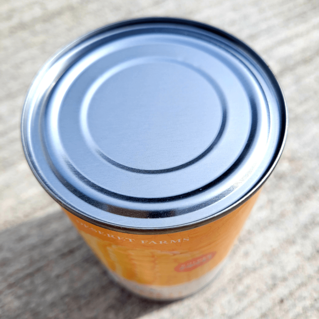 Image illustrating a canned food item to demonstrate how to open a can of food with your bare hands. 