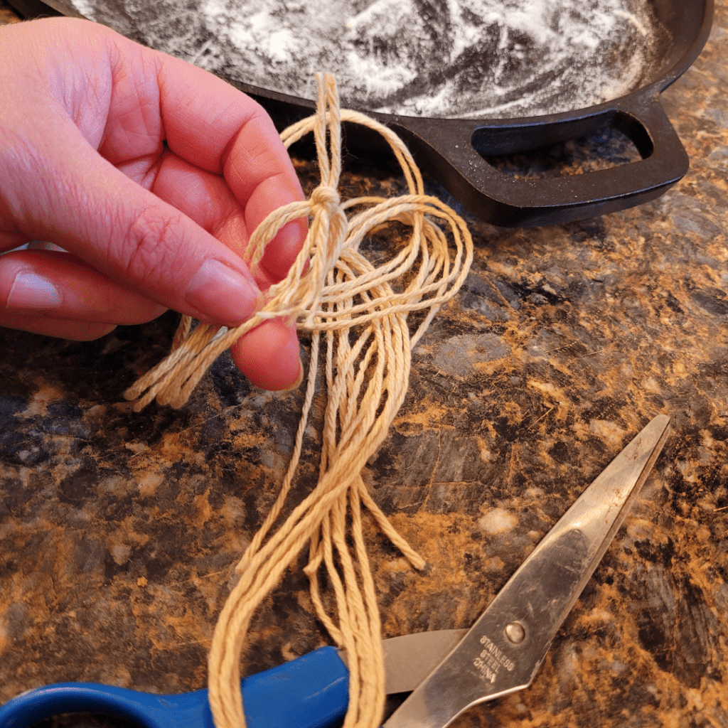 Image illustrates cotton string for tying a pumpkin-shaped sourdough bread.