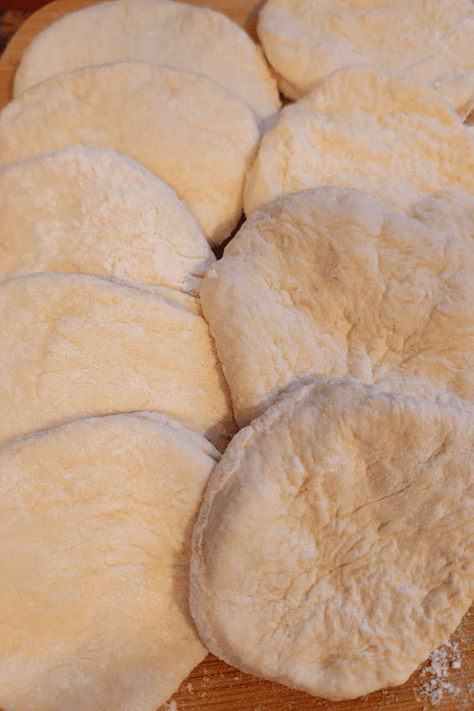 Image illustrates rolled and cout out fry bread dough.