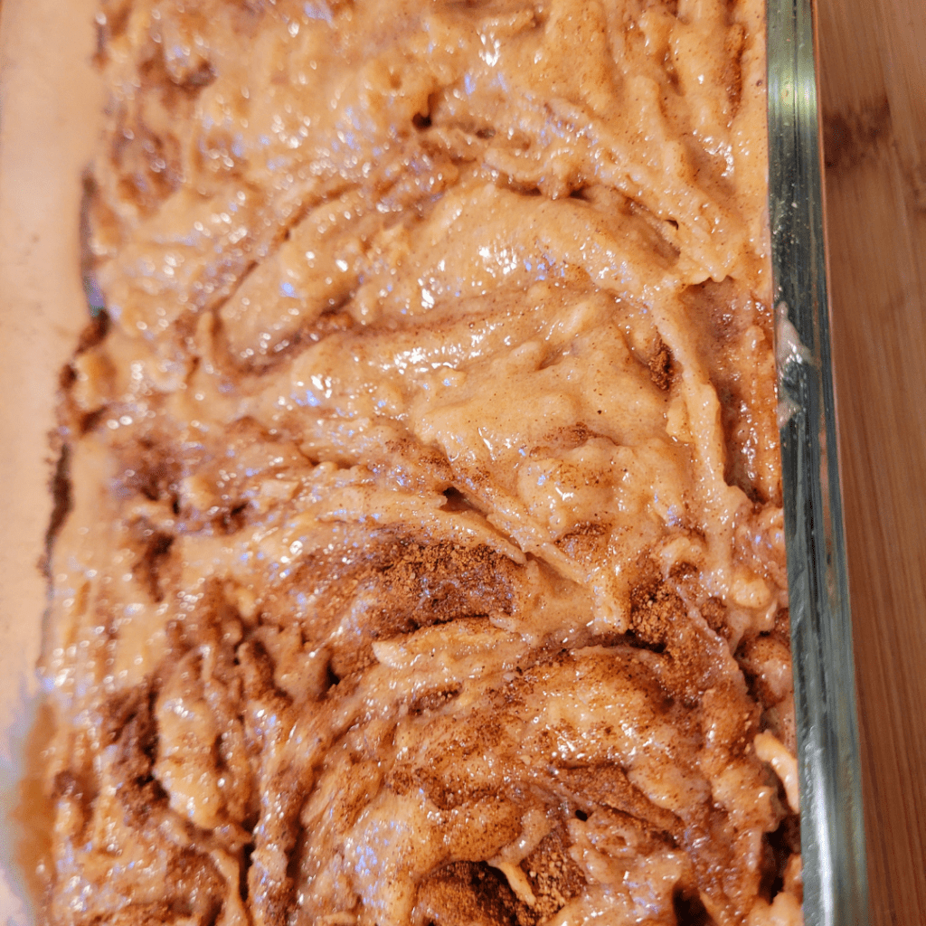 Image illustrates batter of apple cinnamon bread. 