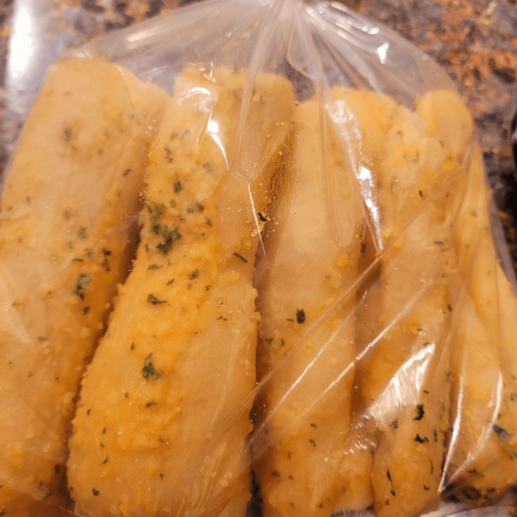 Image illustrates packed sourdough breadsticks.