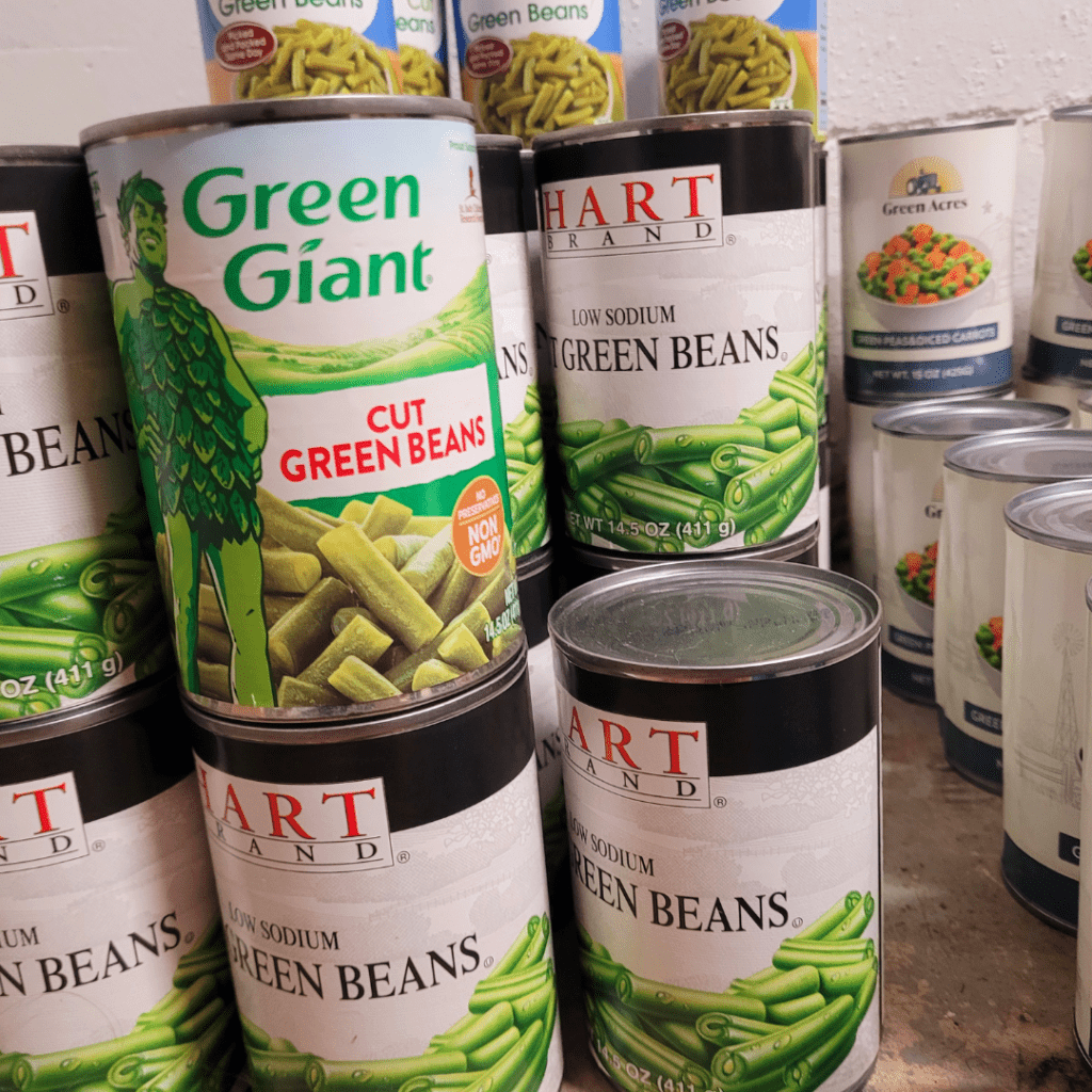 Image illustrates canned food items demonstrating how to stock a working pantry. 