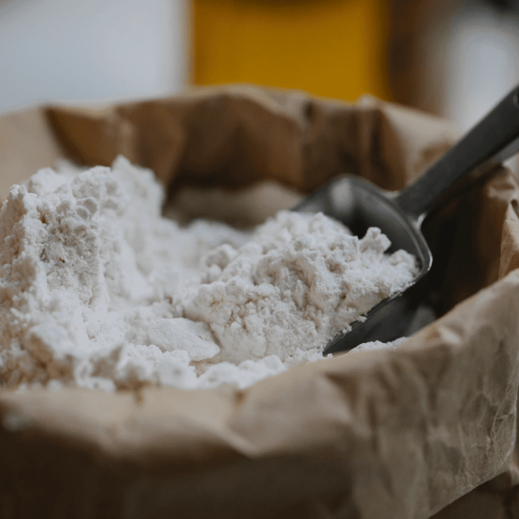 Image illustrates a large bag of flour. 