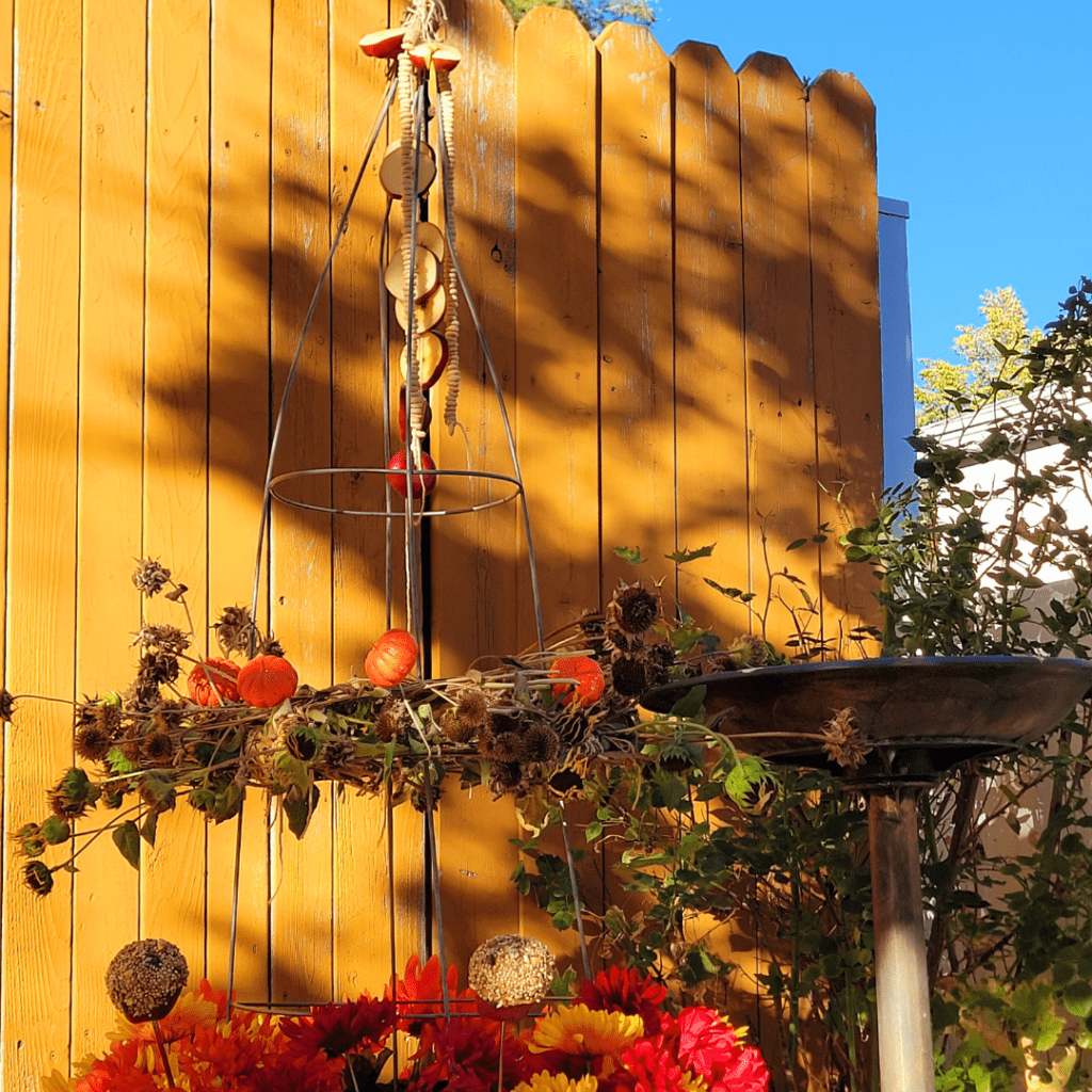 Image illustrates a bird feeder obelisk garden demonstrating how to make a bird feeder obelisk garden.
