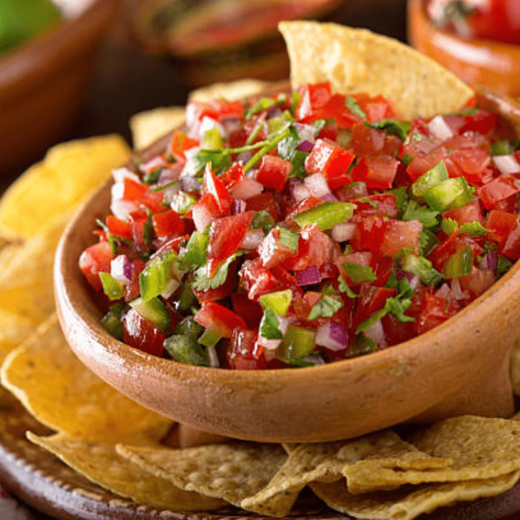 Image illustrates a dish of salsa demonstrating how to plant and grow a salsa garden.