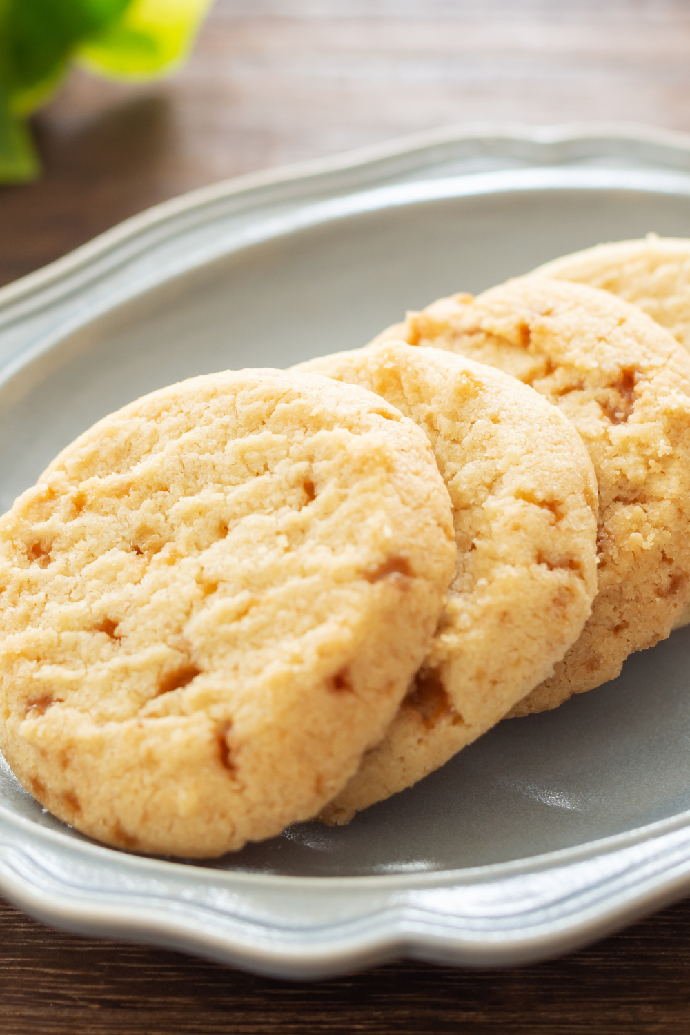 Image illustrates white chocolate macadamia nut cookies for 25 days of Christmas cookies.