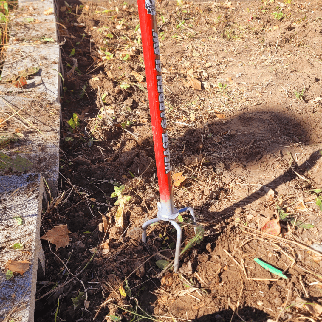 Image illustrates a garden claw tiller demonstrating how to use the hand twist claw tiller.
