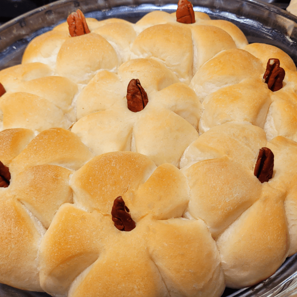 Image illustrates pumpkin-shaped bread rolls. 