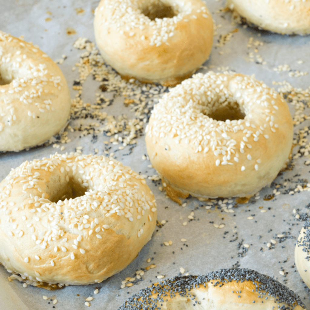 Image illustrates baked bagels for how to make sourdough bagels. 