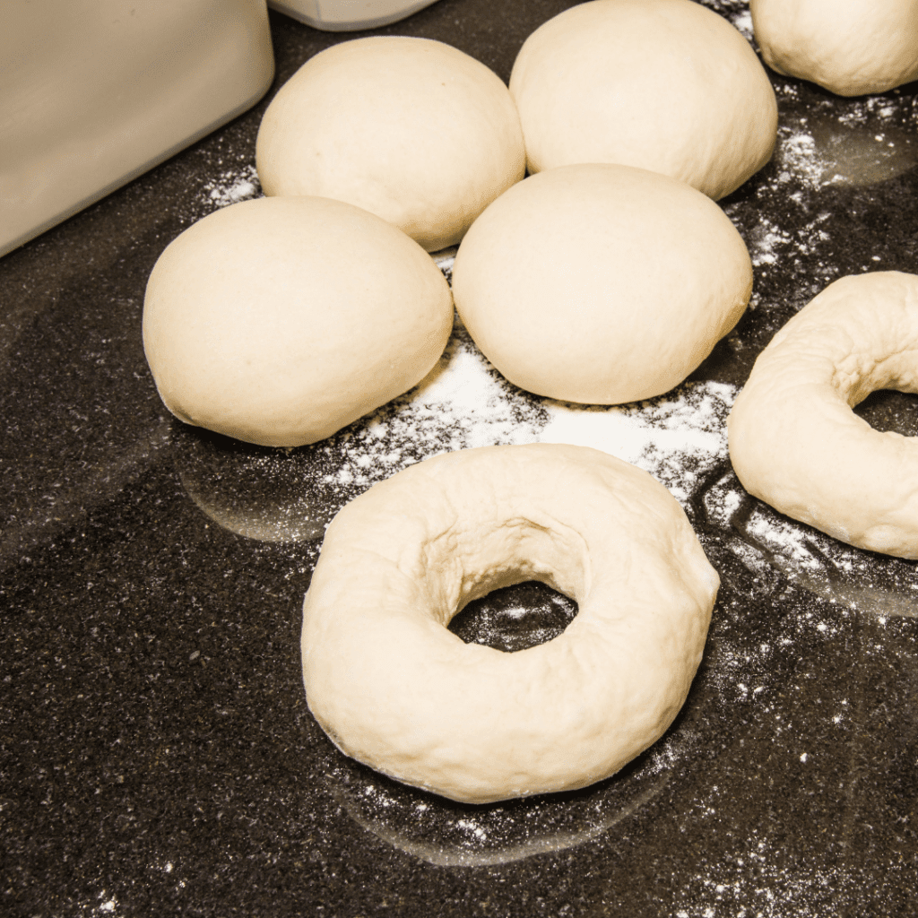 Image illustrates dough for bagels for how to make sourdough bagels. 