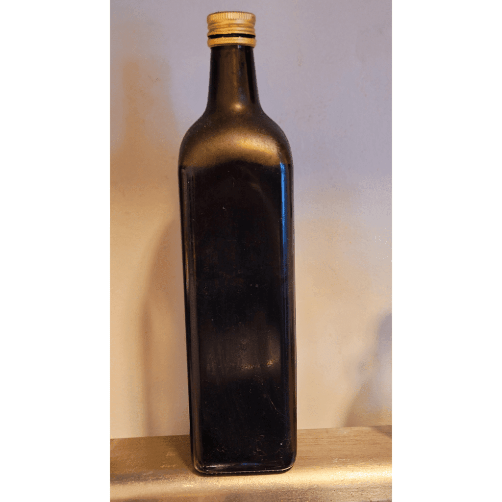 Image illustrates a balsamic vinegar bottle for a balsamic onion jam recipe.