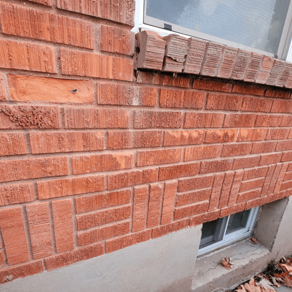 Image illustrates a foundation of a brick house. 
