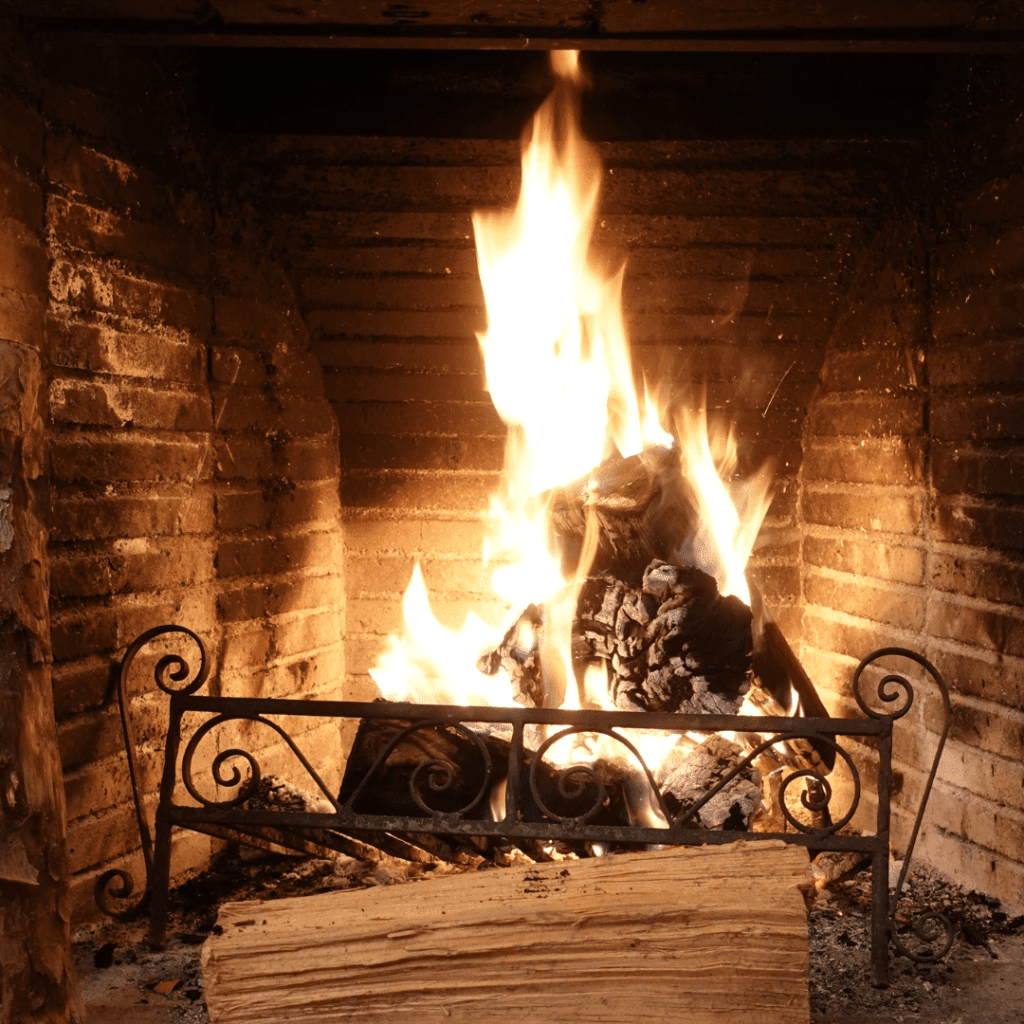 Image illustrates a cozy fireplace. 