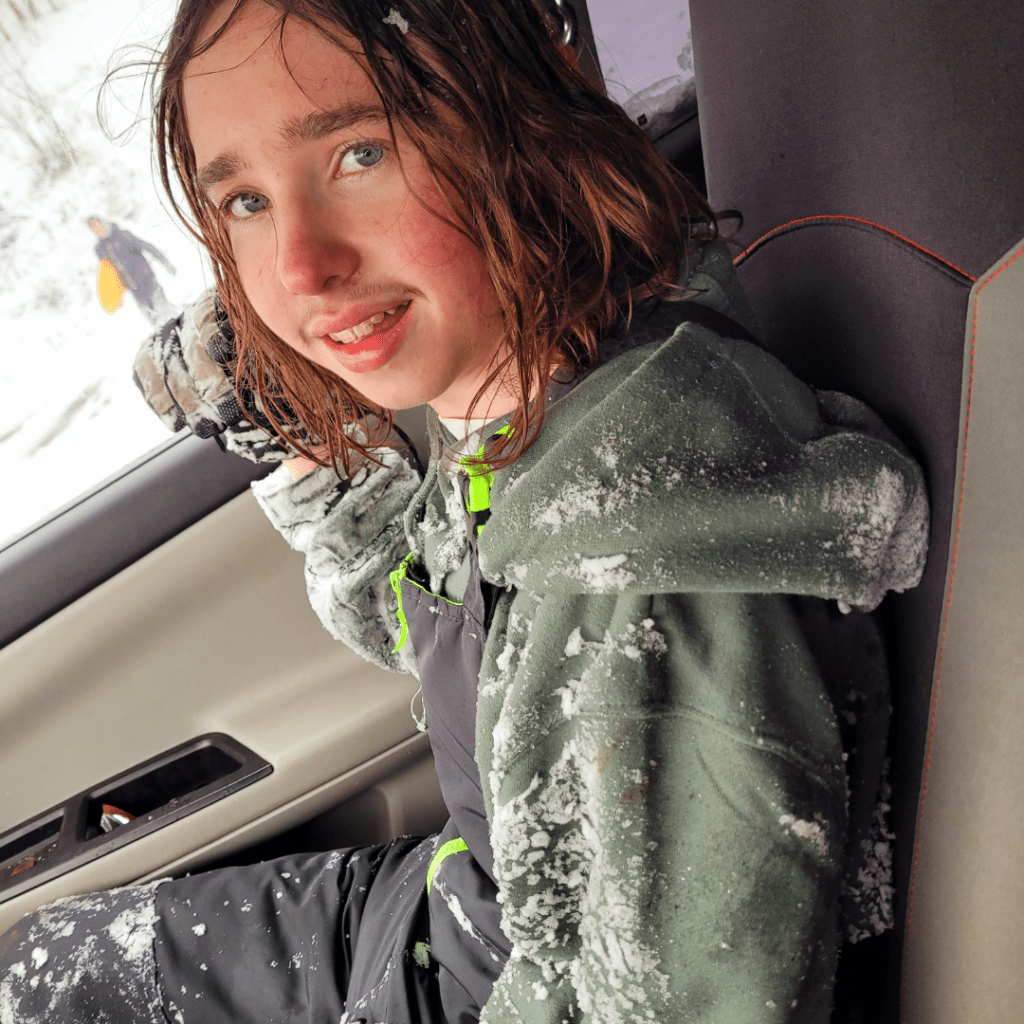 Image illustrates a teen boy geared up for mountain sledding demonstrating information on mountain sledding with teens.