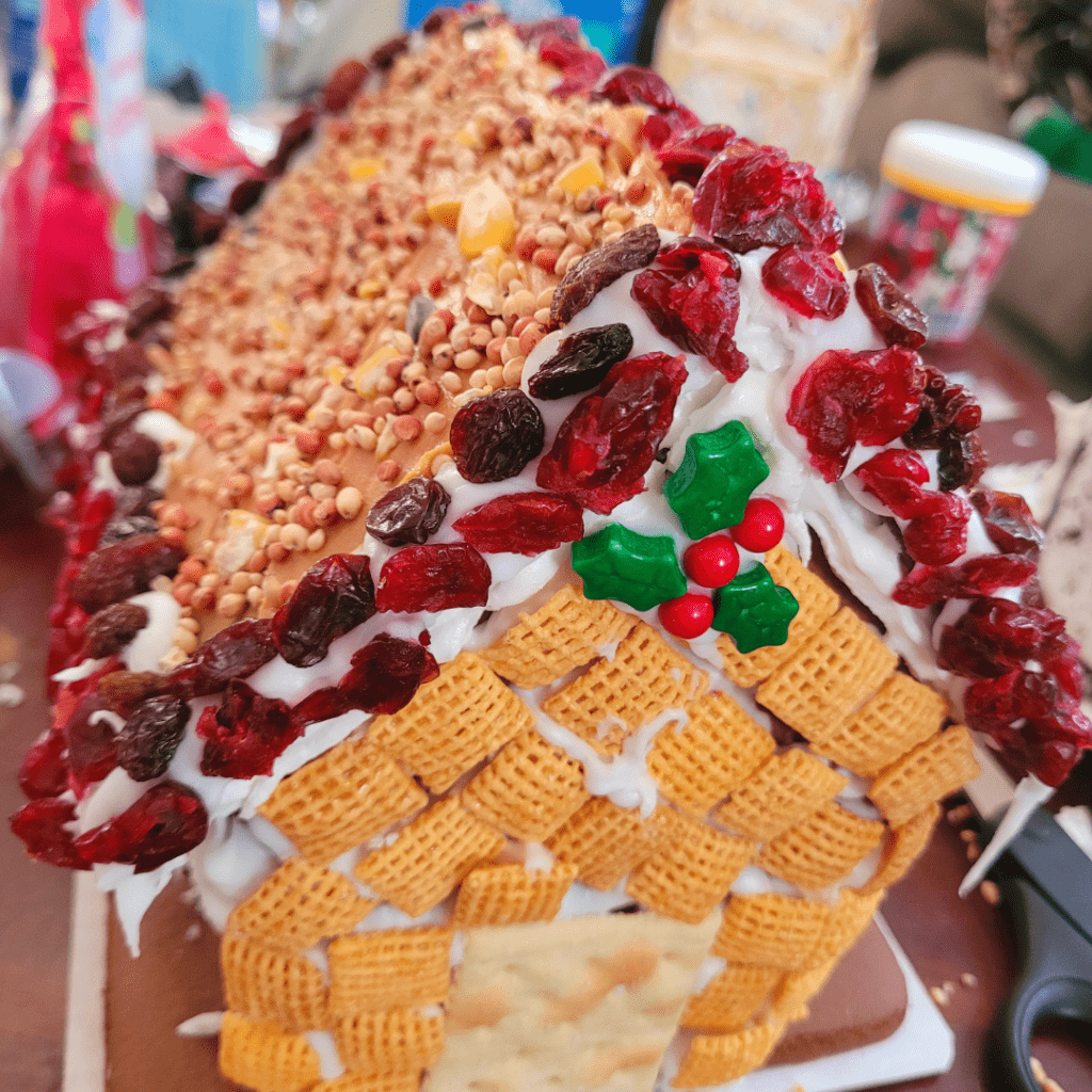 Image illustrates a birdfeeder gingerbread house.