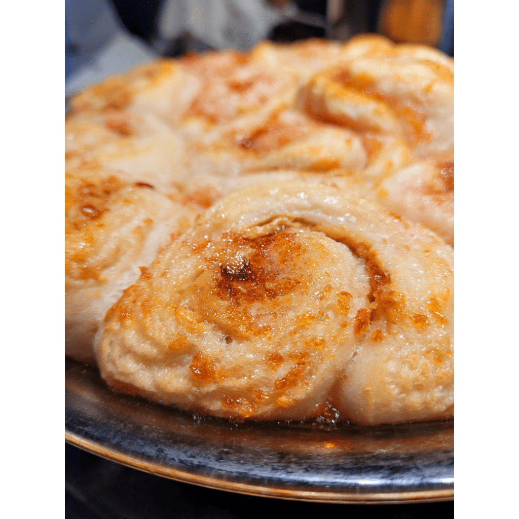 Image illustrates baked peanut butter and jelly rolls.