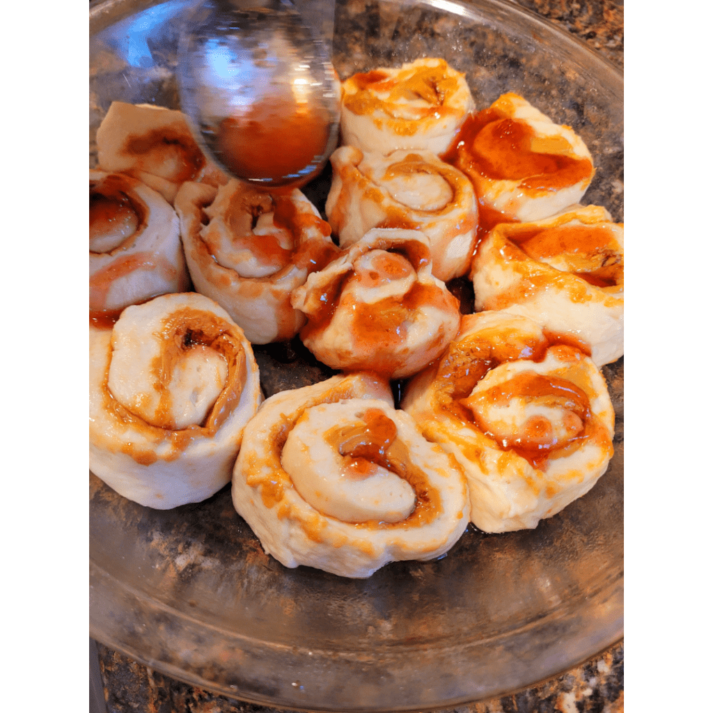 Image illustrates peanut butter and jelly rolls rising before baking.