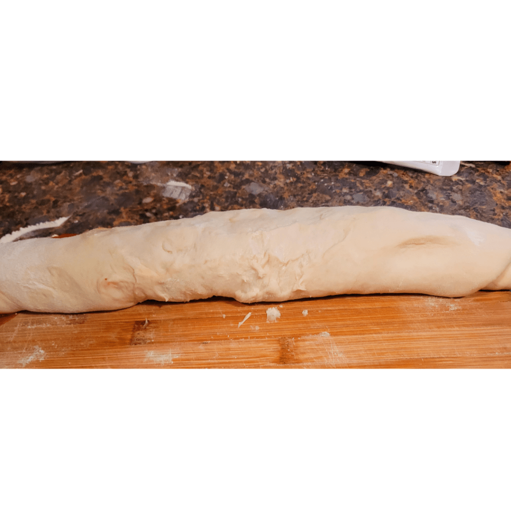 Image illustrates dough rolled up for peanut butter and jelly rolls.