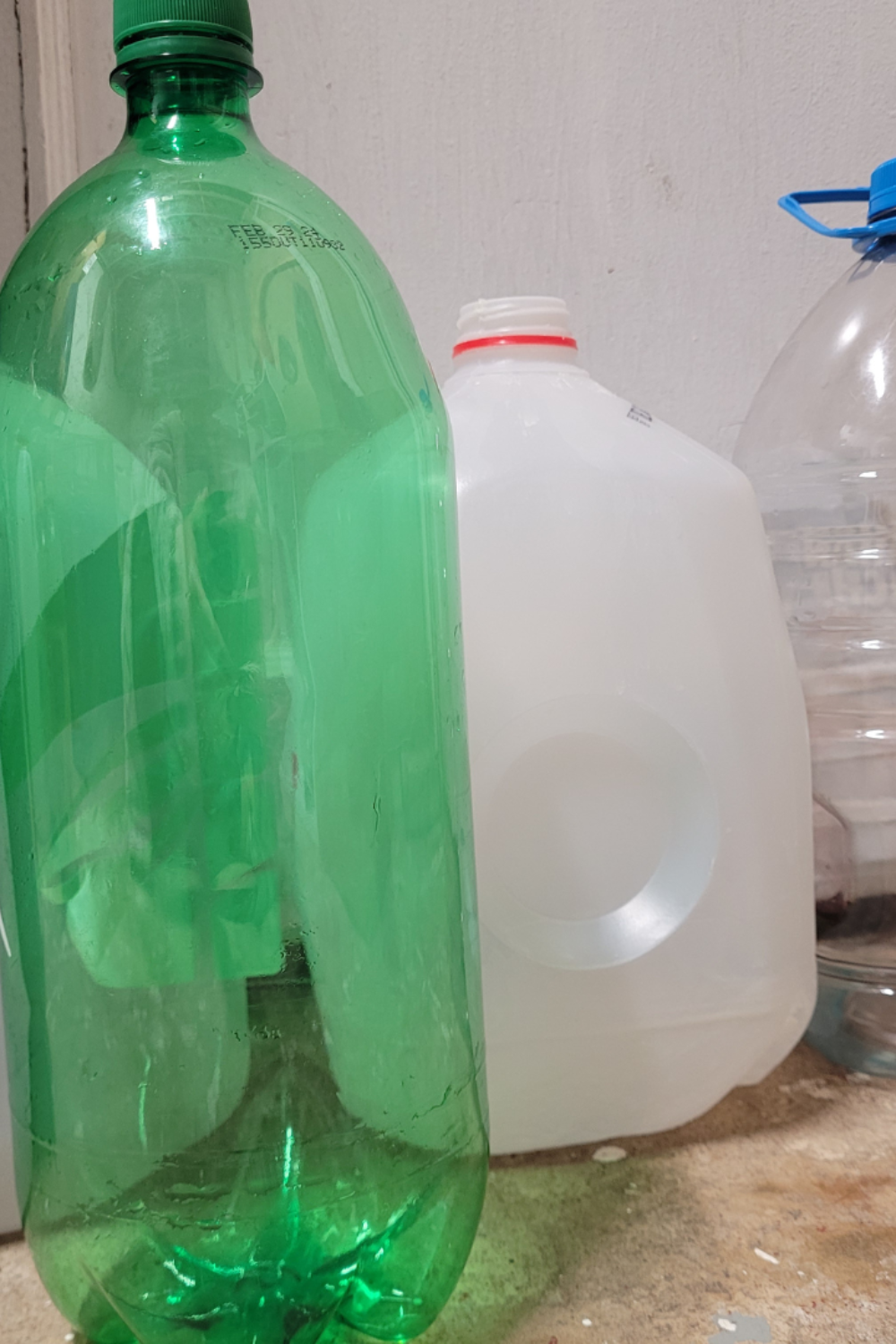 Image illustrates an image of plastic containers for successful winter sowing for vegetables. 