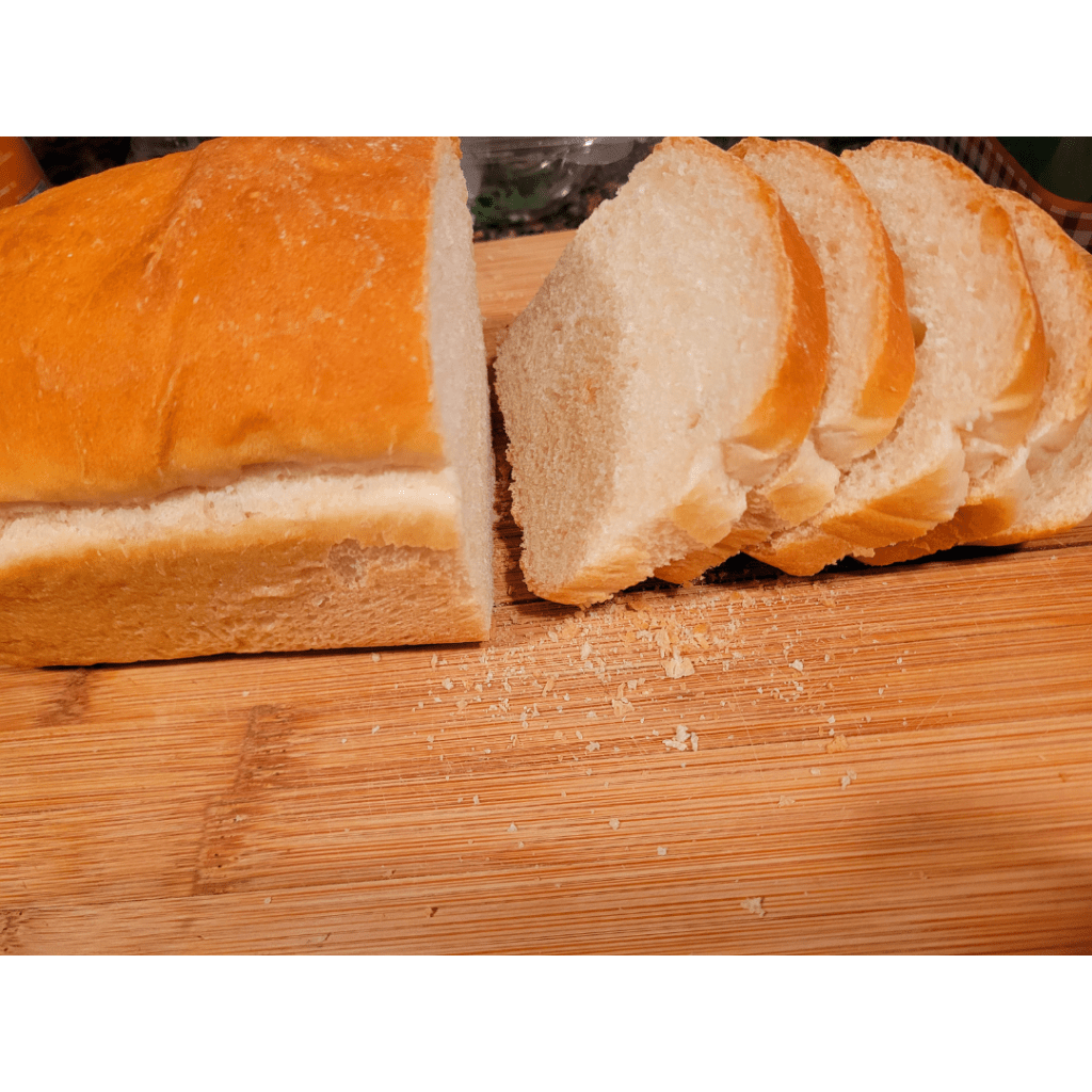 Image illustrates sliced sourdough bread for sourdough French toast. 