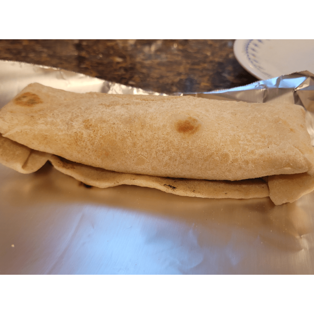 Image illustrates a homemade burrito.