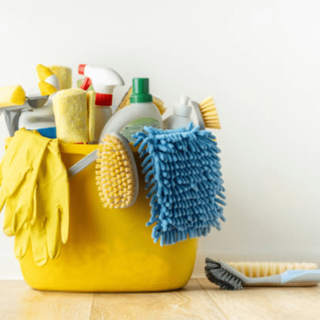 Image illustrates cleaning supplies for spring cleaning house checklist information. 