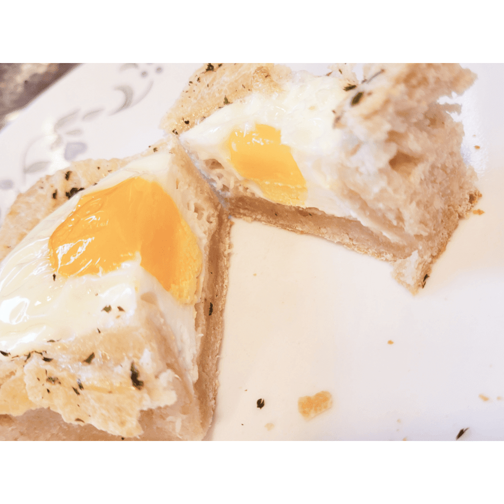 Image illustrates sourdough focaccia bread with eggs. 