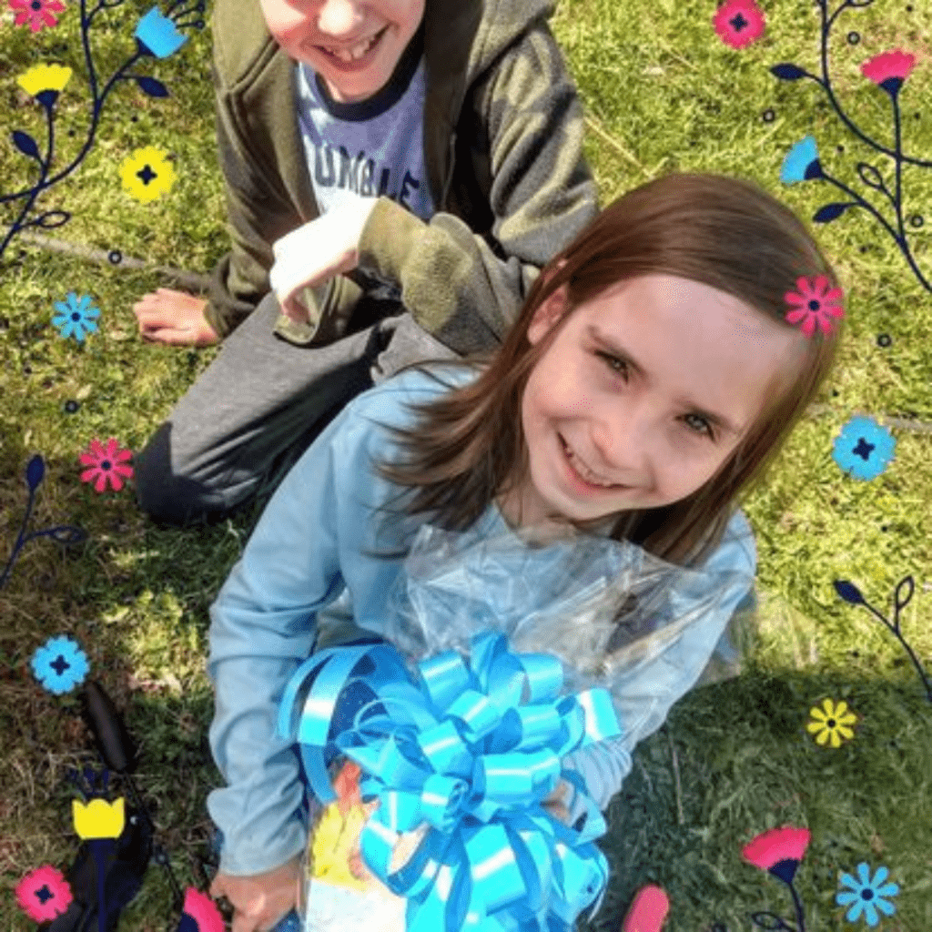 Kids opening up Easter presents. 