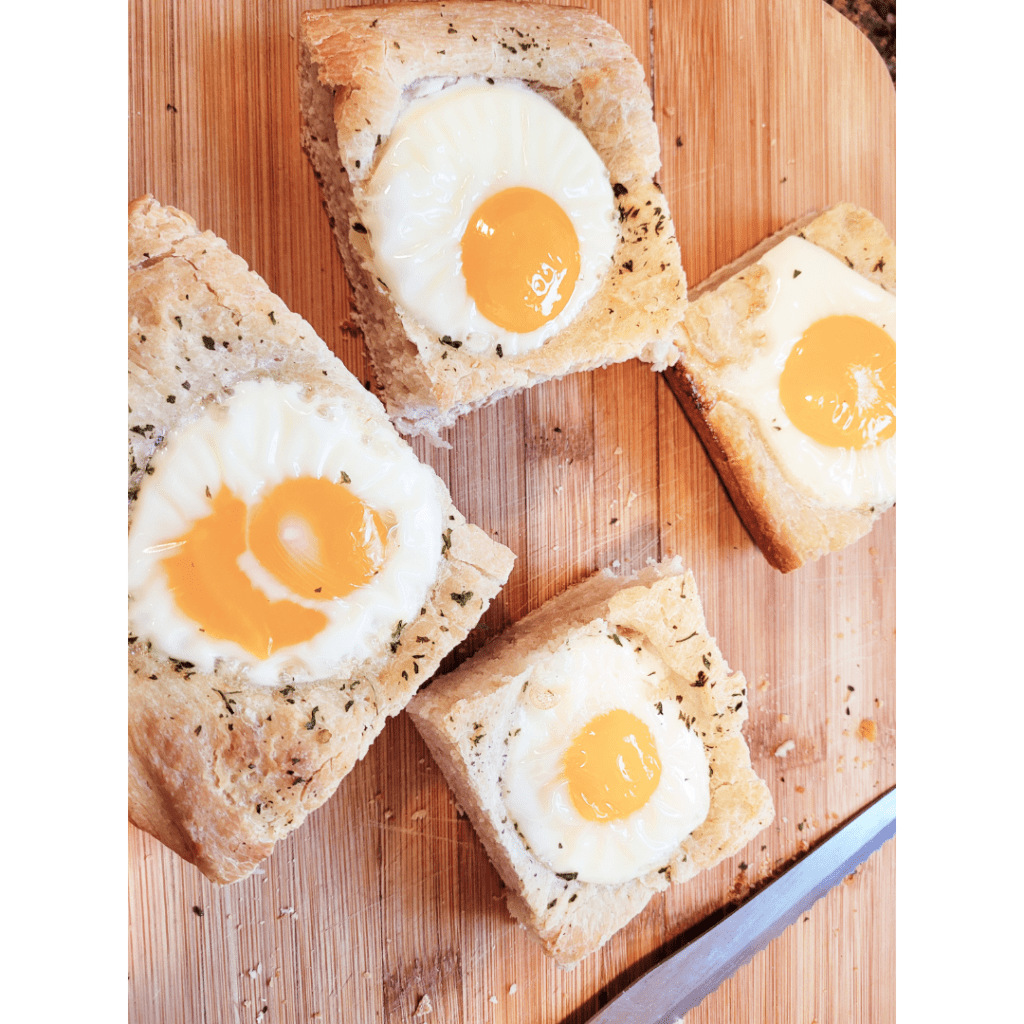 Image illustrates sourdough focaccia bread with eggs. 
