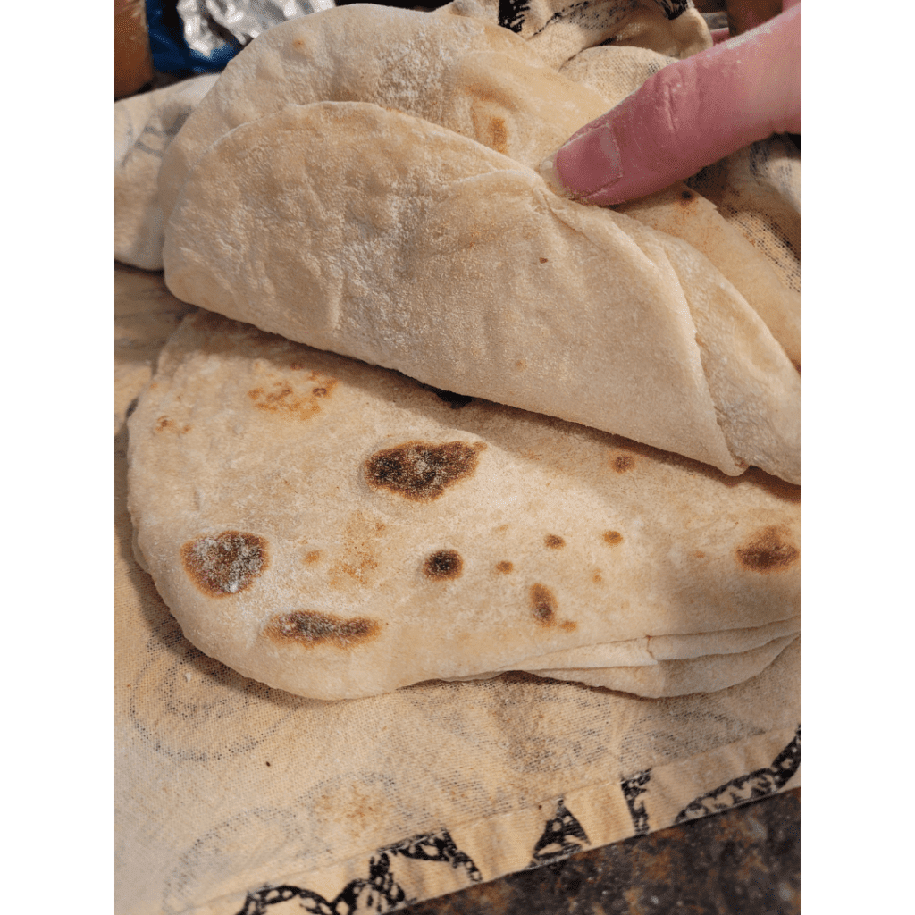 Image illustrates homemade sourdough tortillas.