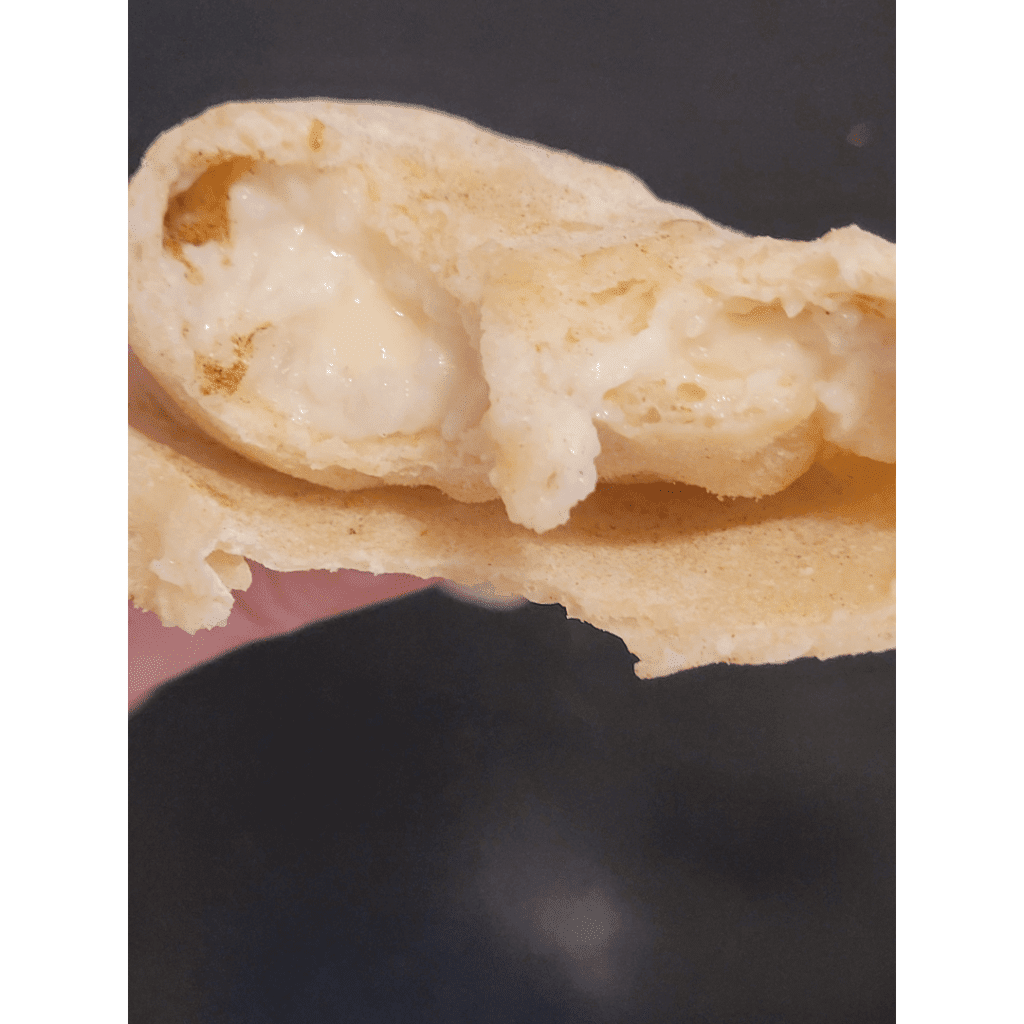 Image illustrates a cheesy burrito made with sourdough tortillas.
