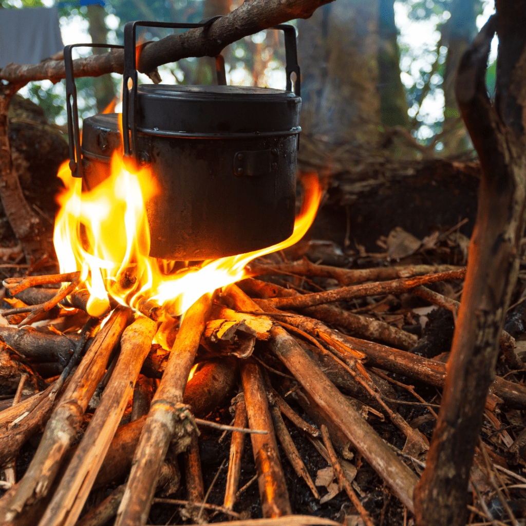 Image illustrates cooking over a fire for emergency cooking. 