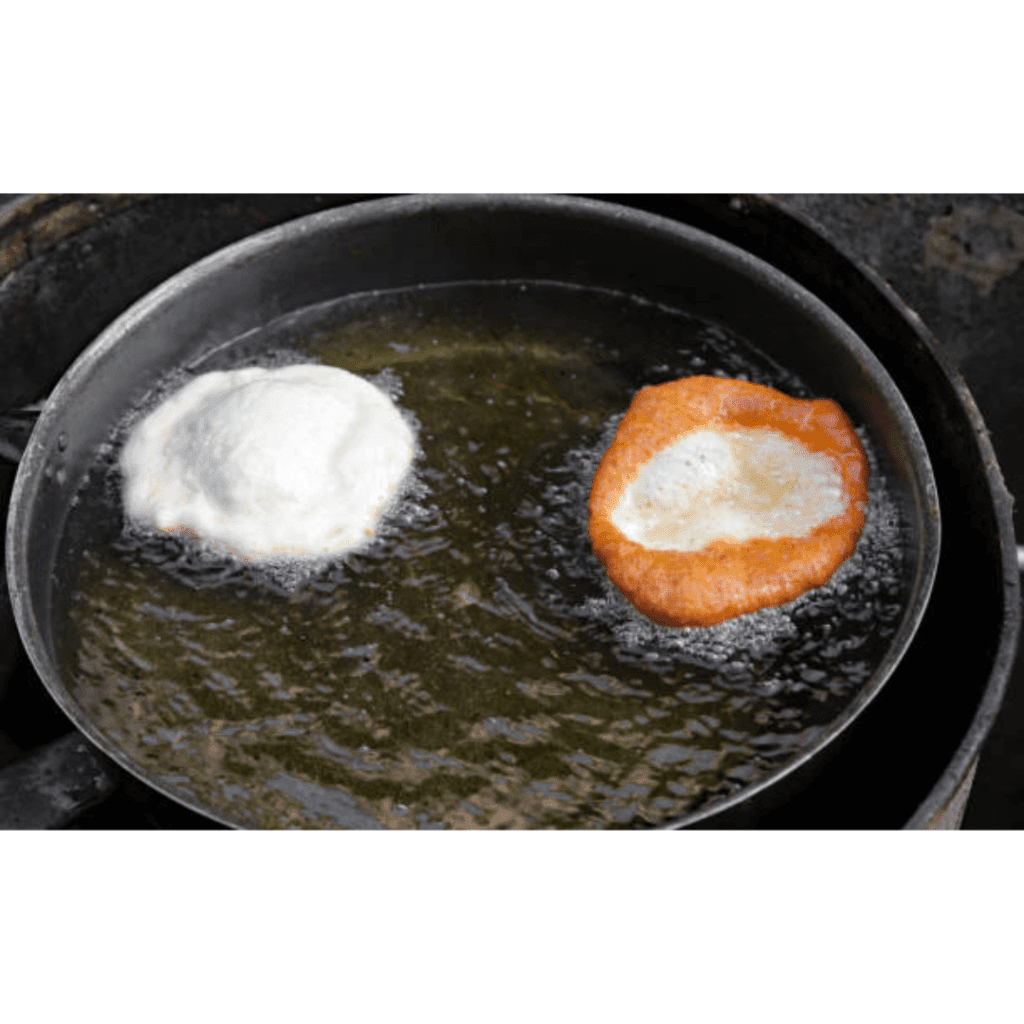 Image illustrates cooking sourdough discard fry bread. 