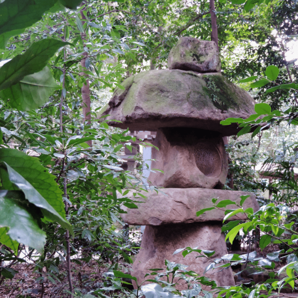 Image illustrates tea lanterns toro in a Japanese tea garden. 