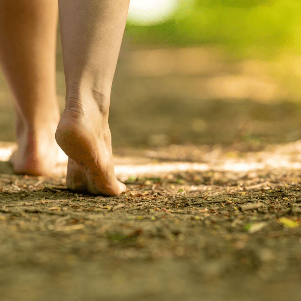 Image illustrates barefoot in dirt for barefoot grounding.