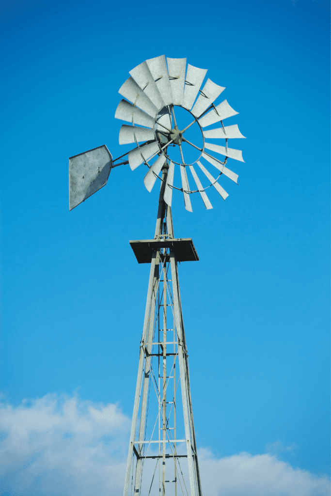 Image illustrates a windmill for how to live off-grid. 