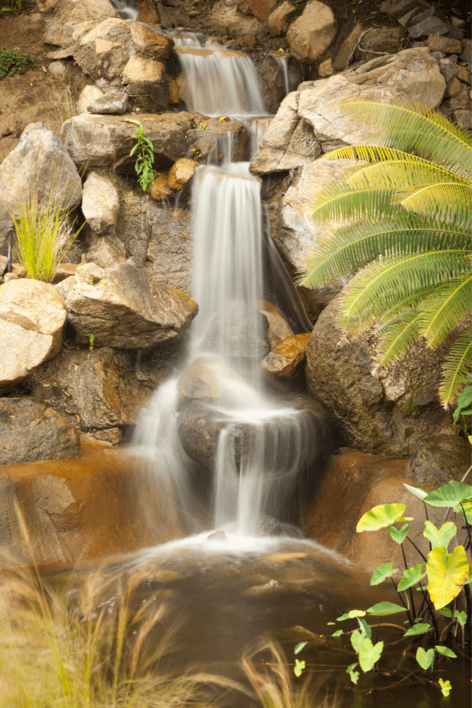 Image illustrates a tranquil waterfall. 