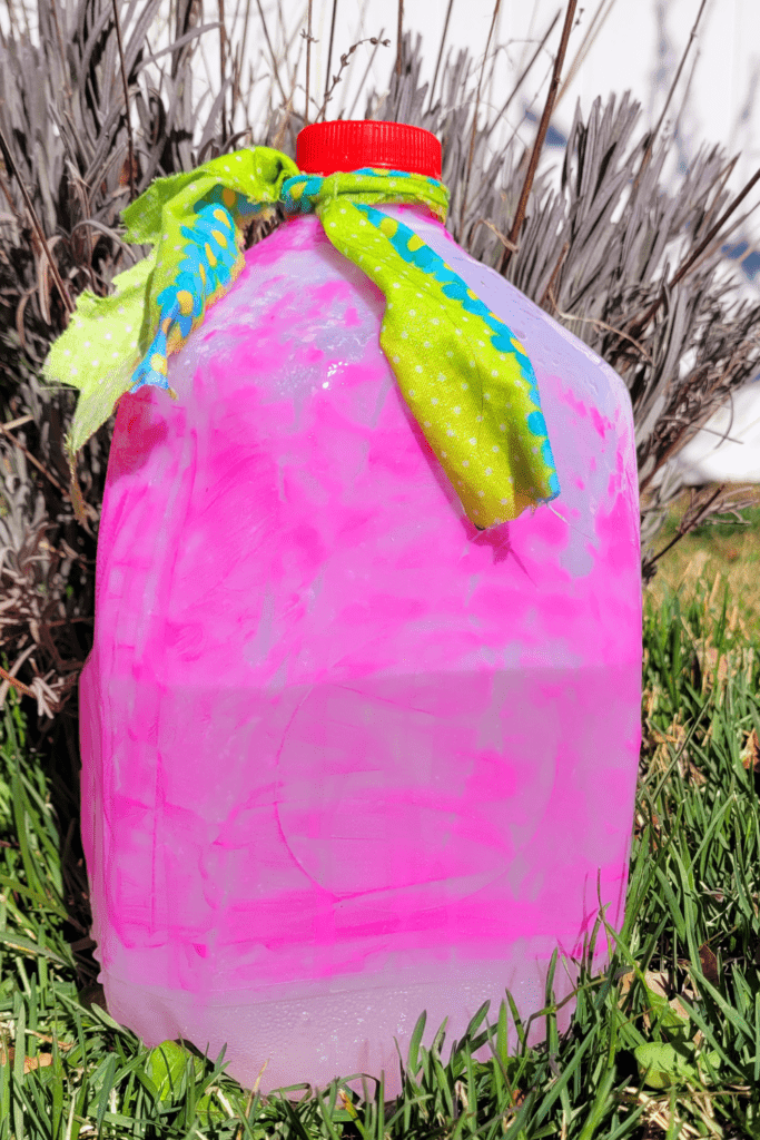 Image illustrates a milk jug drip irrigation system.